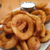 Onion Rings · Onions rings served with side of house made ranch. Vegetarian.