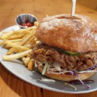 Cluck You Chicken Sandwich  · pickle-brined fried chicken, spicy cabbage slaw, herb aioli*, sweet pickles,