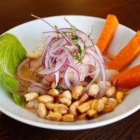 Ceviche Pescado Classico (Best in Town) · Fresh catch of the day cubed and marinated in the aji limo leche de tigre.