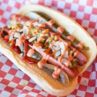 Outrageous Dog · All beef jumbo hot dog topped with relish, chopped onion, a pickle and sweet or hot peppers.