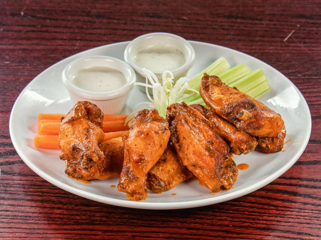 12 Piece Signature Wings · Comes with celery, carrots choice of wing sauce and choice of blue cheese and/or garlic ranch dressing. Note: Cannot order just flats or just drums.