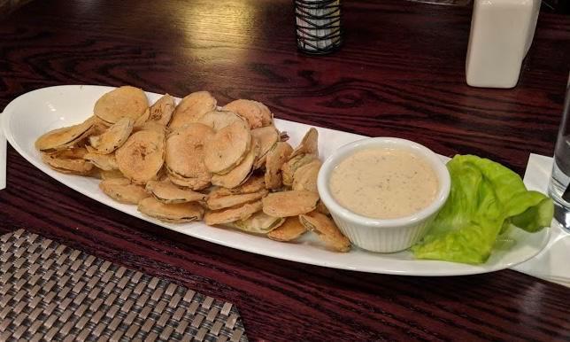 Fried Pickles · Thinly sliced pickles, buttermilk marinated, spiced flour, side car of chipotle-ranch dressing.