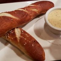 Bavarian Pretzel Sticks · Served with a sidecar of our signature spicy queso & spicy mustard.