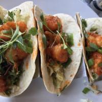Pow Pow Shrimp Tacos · Tempura shrimp tossed in pow pow sauce with lime dressed slaw and micro cilantro served with...