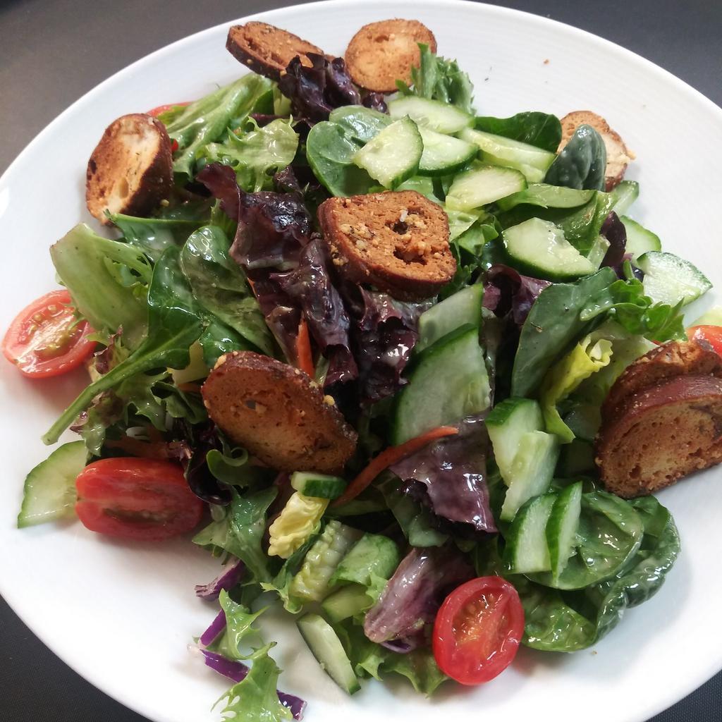House Salad · Artisan lettuce, pretzel croutons, cucumber, carrots, tomatoes, Champagne vinaigrette on the side. Add-ons for an additional charge.
