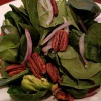 Baby Spinach Salad · Baby spinach, shaved Bermuda onion, avocados, Campari tomatoes, spiced pecans, chile-lemon d...