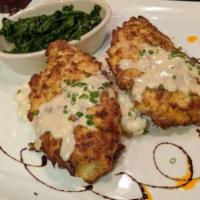 Chicken Piccata · Sauteed baby spinach, fontina cheese risotto, lemon-caper butter sauce.