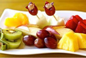 Fresh Fruit Plate · An assortment of fresh fruits. Fruits: apple, kiwi, banana, strawberry, grapes, orange, melo...