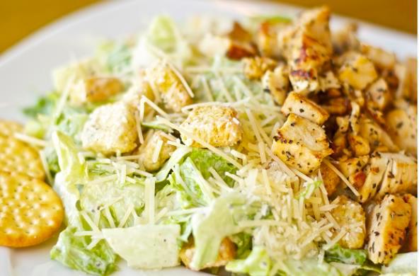 Chicken Caesar Salad · Freshly made Caesar salad. Base of romaine with Caesar dressing, chicken, croutons, crackers, Parmesan cheese.