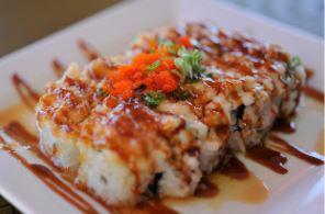 All About Scallop Roll · All About Cha Original sushi roll. Baked scallops on top of a california roll. Topped with m...