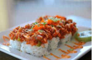All About Tuna Roll · All About Cha's original sushi roll. A California roll base. Topped with spicy tuna, jalapeñ...
