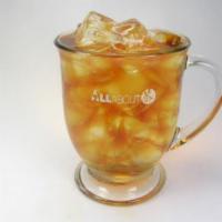 Iced Traditional Tea · Unsweetened iced tea made with an earl grey and chilled over ice. Garnished with a lemon sli...