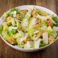 Caesar Salad · Crisp romaine lettuce hearts, toasted garlic croutons, and shaved Asiago cheese served with ...