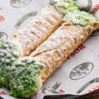 2 Cannolis · Crisp sicilian pastry shells filled with sweetened ricotta, chocolate chips, dipped into pis...