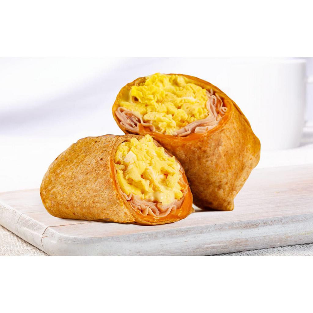 Breakfast Burrito · Ham, double eggs, cheddar and breakfast sauce in a whole wheat wrap.