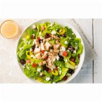 Greek Salad · Romaine, grilled chicken, feta, Roma tomato, olives, banana peppers and Italian dressing.