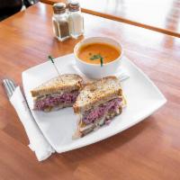 Patty Melt · 6 oz Burger patty in our own Rue bread with our secret sauce, grill onions and Swiss cheese.