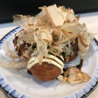 4 Piece Takoyaki · Fried dough ball with octopus inside.