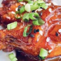 Sweet Chilli Chicken Wings · Fried chicken wings glazed in sweet and spicy Asian sauce.