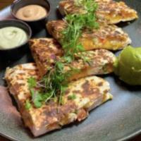 Chicken Quesadilla · Flour tortilla with a cheese blend, grilled chicken breast, pico de gallo served with guacam...