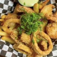 Fish and Chips Cape Town Style · Deep-fried fish, shrimp, and calamari rings served with French fries.
