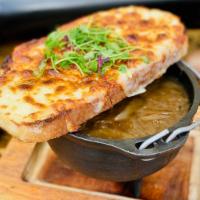 Onion Soup · Classic French onion soup with beef broth, caramelized onions, and toasted rustic bread au g...