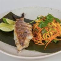 Thai Snapper · Grilled snapper served with Asian street sauce and a fresh Thai style green mango salad.