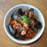 Steamed Mussels · Sauteed in pomodoro sauce, white wine and fresh herbs.