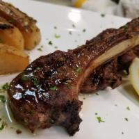 Lamb Chops · Greek-style lamb chops. Served with a side choice and small Greek salad.