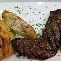 Skirt Steak · Flame-broiled 10 oz. steak marinated with extra virgin olive oil and Greek herbs.