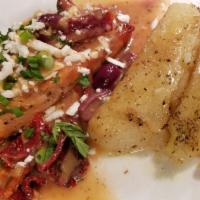 Greek Style Salmon · Grilled salmon with sun-dried tomatoes, Kalamata olives, feta cheese, and our own special sa...