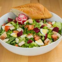 Gotham Salad · Green leaf lettuce, chicken, bacon, provolone, hard boiled egg, tomatoes and beets tossed wi...