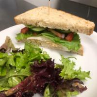 Veggi Sandwich · Avocado, provolone, lettuce, cucumber, tomato, red onion and hummus on ciabatta grain. Baked...