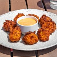 Crab Hush Puppies · lump blue crab, cheddar, jalapeños, sweet peppers, remoulade