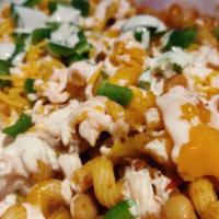 Chili Mac · Pasta smothered in chili, topped with melted cheddar & American cheese, sour cream & jalapen...