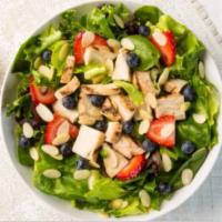 Berry Chicken Almond Salad · Spinach, spring lettuce, grilled chicken, fresh strawberries, fresh blueberries, almonds, an...
