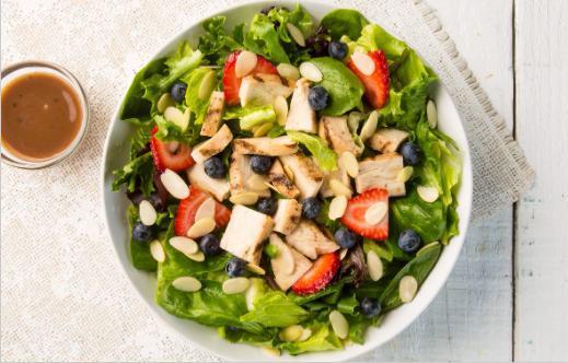 Berry Chicken Almond Salad · Spinach, spring lettuce, grilled chicken, fresh strawberries, fresh blueberries, almonds, and balsamic vinaigrette.