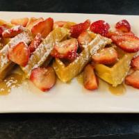 Strawberry N Salted Caramel Waffles · Belgium waffles topped with fresh strawberries and salted maple caramel sauce.