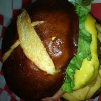 Pretzel Burger · Gourmet pretzel bun from Prezilla baking company, comes with  mayo,ketchup,lettuce,onions,to...