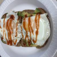 Avocado Toast · Sunny Side Egg, Avocado & hot sauce on open faced whole wheat toast