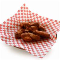 Chicken Wings · Crispy golden deep fried chicken wings marinated in a spicy sauce.