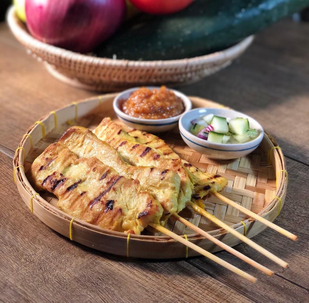 Chicken Satees · Marinated chicken grilled on skewers served with cucumber and peanut sauce.