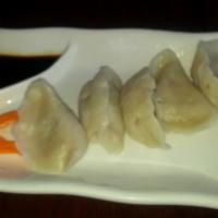 Vegetable Dumplings · Steamed vegetable dumpling served with sweet soy sauce. Vegetarian.
