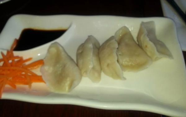 Vegetable Dumplings · Steamed vegetable dumpling served with sweet soy sauce. Vegetarian.