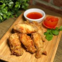 Golden Wing · Fried chicken wings served with sweet chili sauce.