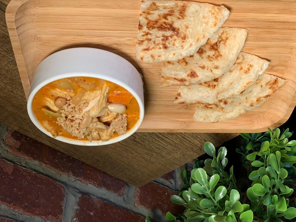 House Special Roti · Pan-roti with chicken, potatoes, onion and peanuts served with massaman curry sauce.