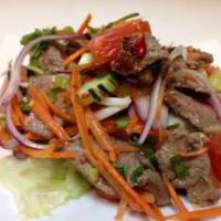 Grilled Beef Salad · Slice steak in chili and lime juice with red onion, cucumber, carrot, tomato herb and chili ...