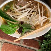 Beef Noodle Soup · Rice stick noodle soup with sliced beef and Thai herb. 