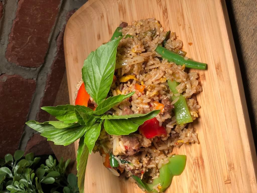Spicy Basil Fried Rice · Served with onion, string bean, carrot, bell pepper and egg in spicy chili basil sauce. Spicy.