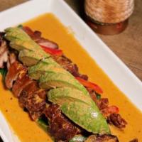 Duck Panang Avocado · A 1/2 roasted duck with avocado, bell pepper, string bean and carrot in panang curry. Served...